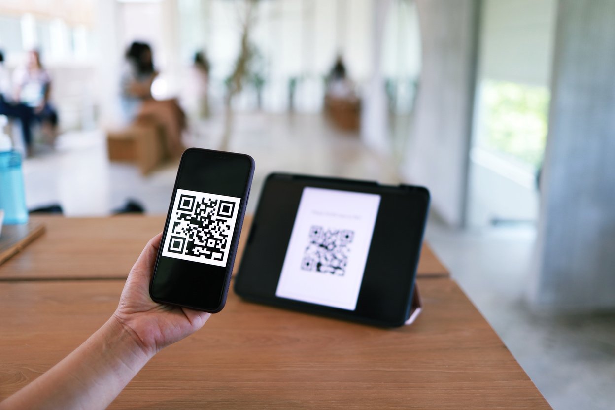 Qr code payment. Woman scanning QR code online shopping cashless