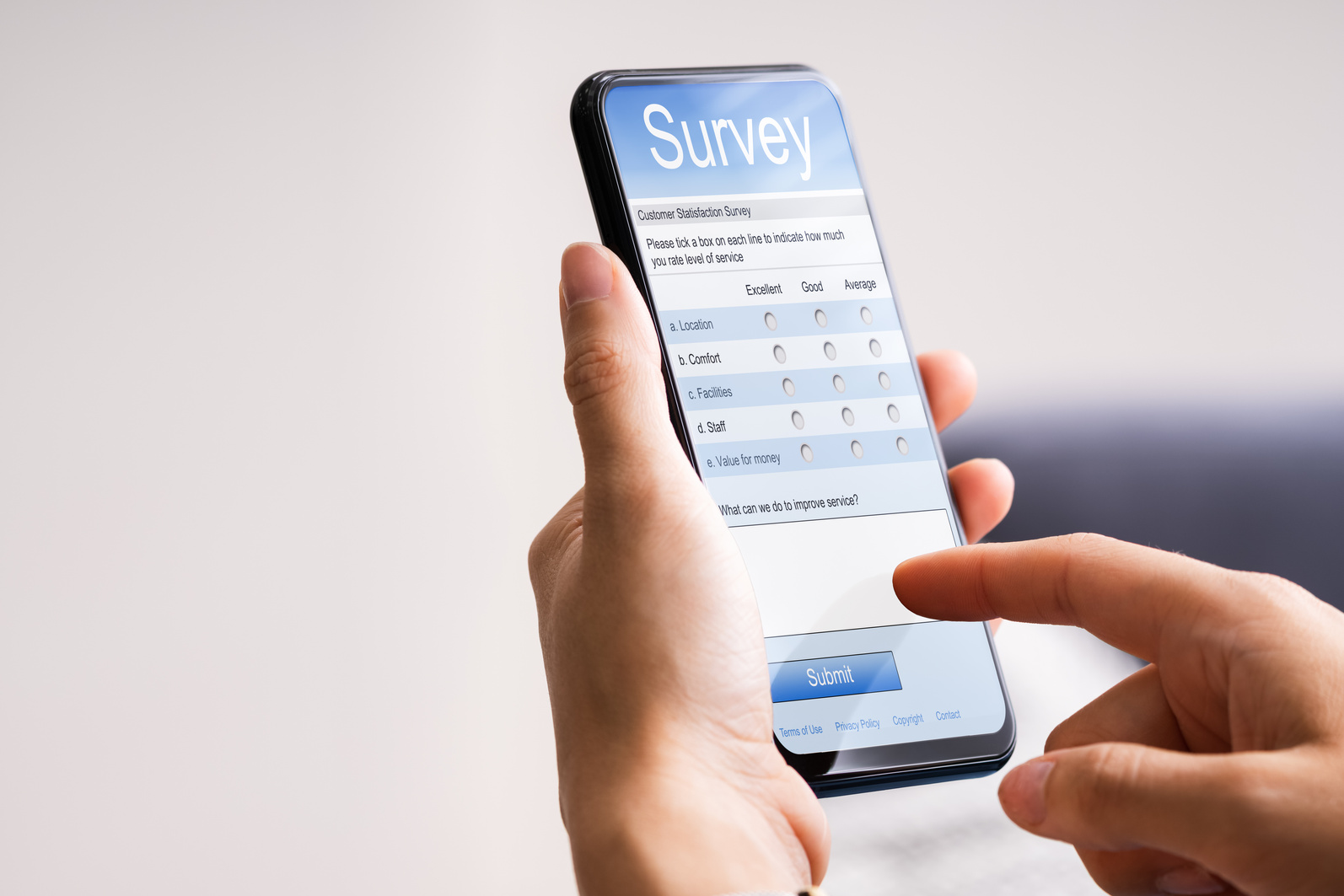Person Filling Online Survey Form On Mobile Phone